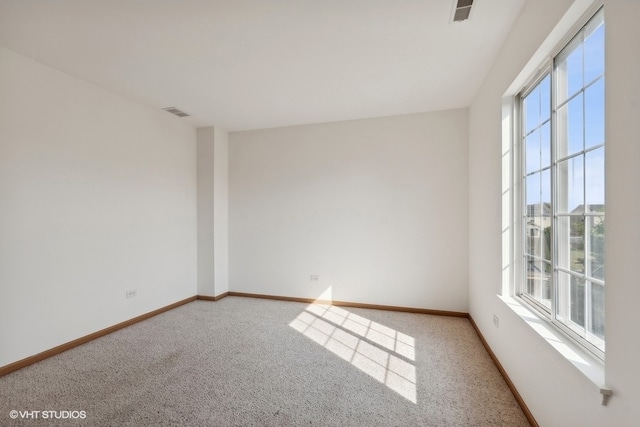 empty room with light colored carpet