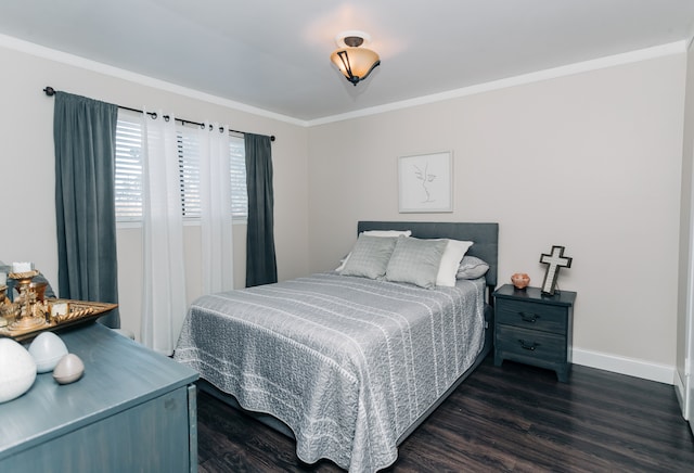 bedroom with crown molding and dark wood-type flooring