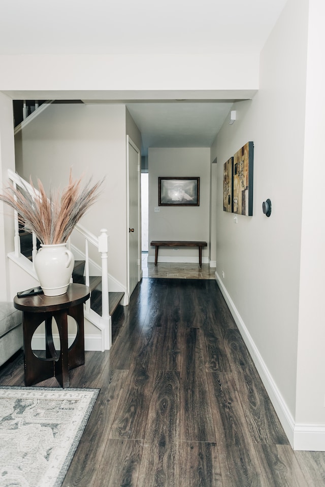 hallway with dark wood-type flooring