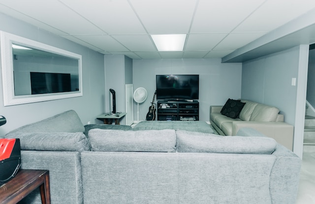 living room with a paneled ceiling