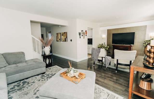 living room with dark hardwood / wood-style flooring