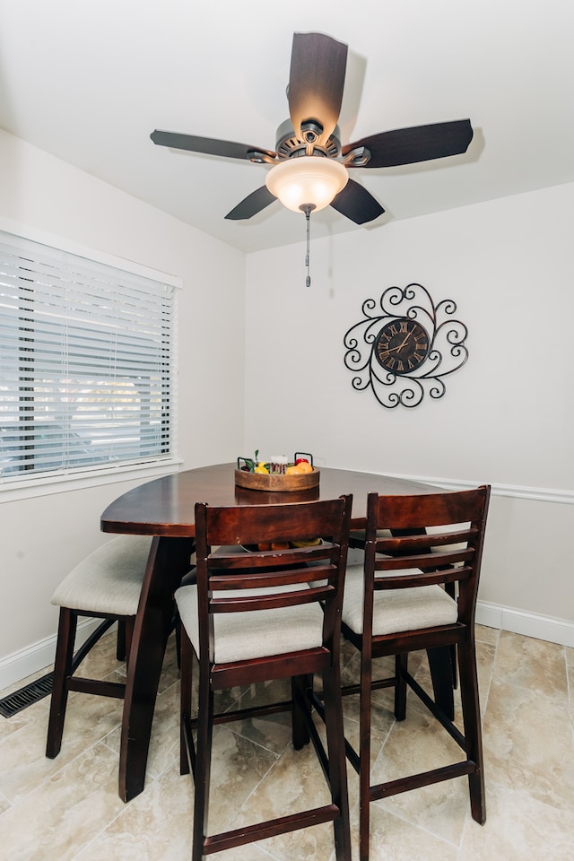 dining area with ceiling fan