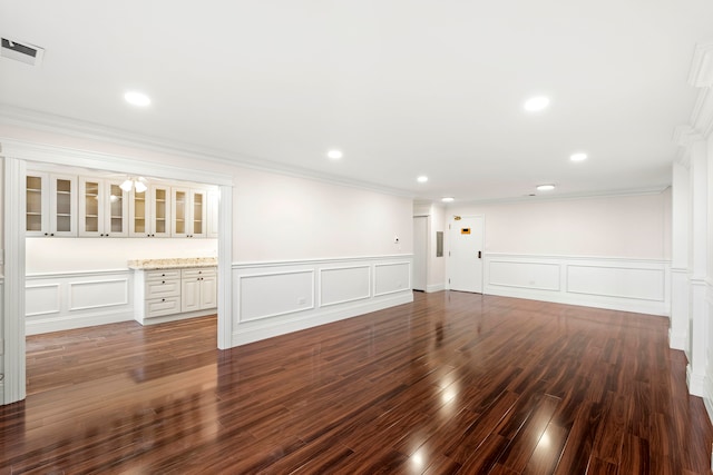 interior space with crown molding and dark wood-type flooring