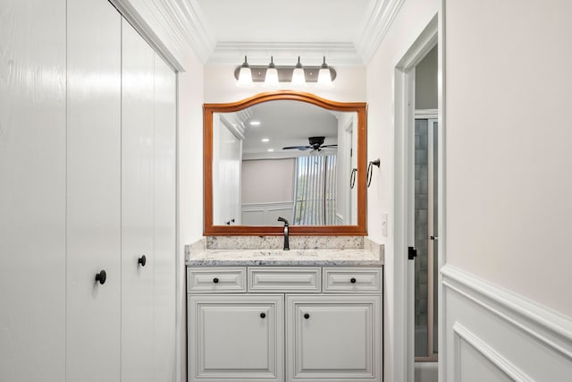 bathroom featuring vanity, ornamental molding, and ceiling fan