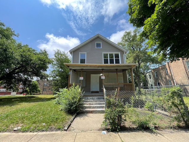 view of front facade with a porch and a front lawn