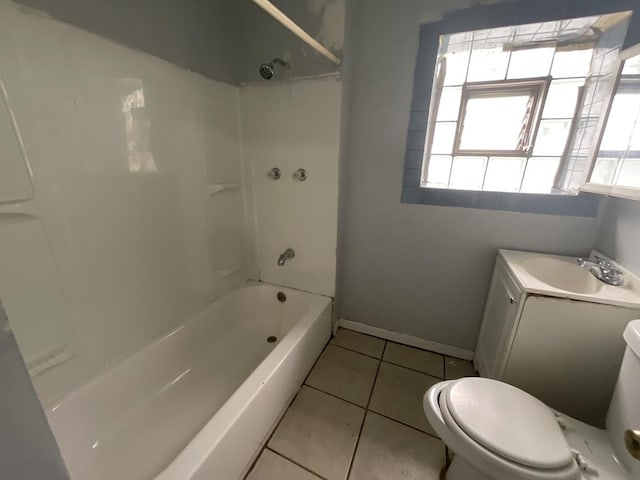 full bathroom with tile patterned floors, vanity, washtub / shower combination, and toilet