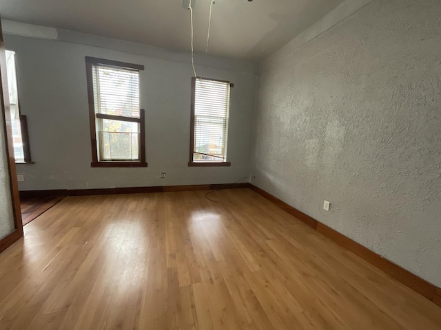 unfurnished room featuring light hardwood / wood-style flooring