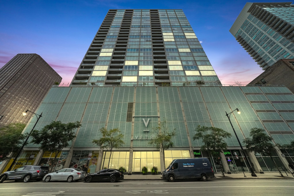 view of outdoor building at dusk