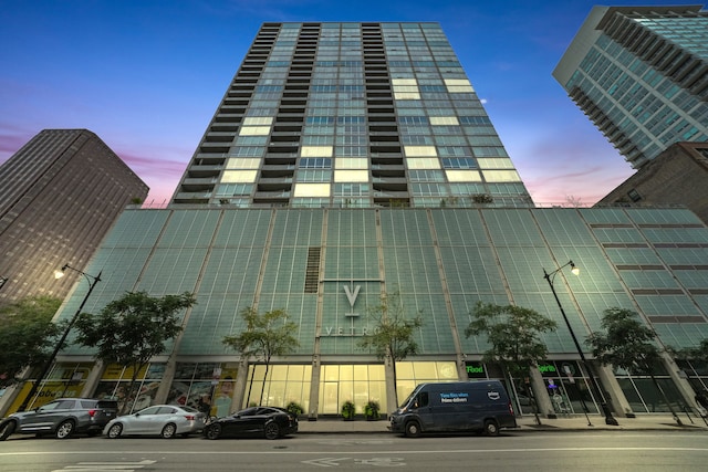 view of outdoor building at dusk