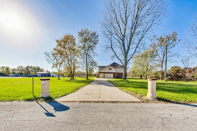 view of front of house featuring a front yard and a garage