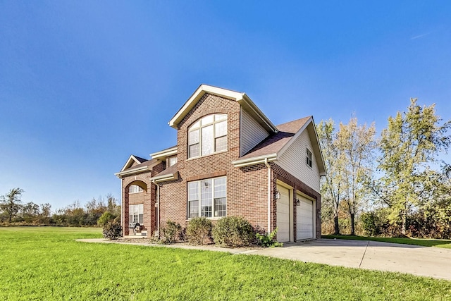 front of property featuring a front lawn and a garage