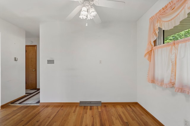 empty room featuring ceiling fan and wood-type flooring