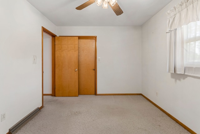 unfurnished bedroom with a closet and ceiling fan