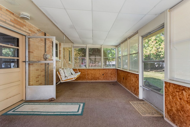 unfurnished sunroom featuring a paneled ceiling