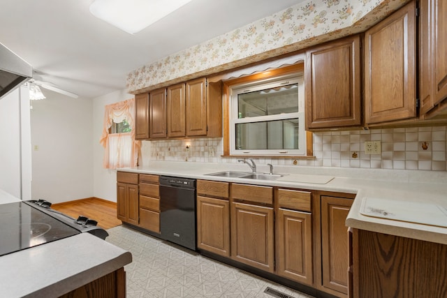 kitchen with sink, dishwasher, ceiling fan, decorative backsplash, and light hardwood / wood-style flooring