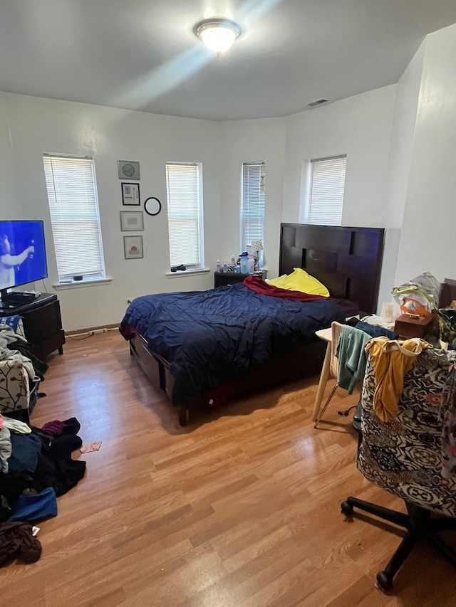 bedroom with light hardwood / wood-style flooring