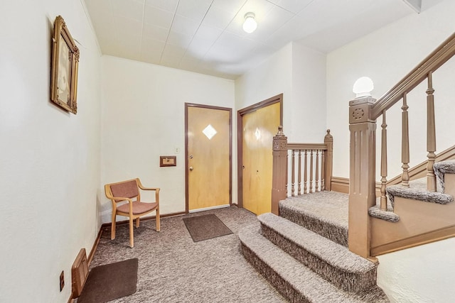 view of carpeted entrance foyer