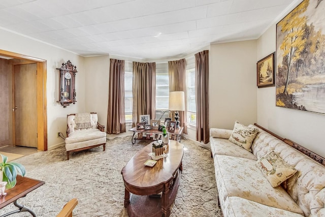 living room featuring light colored carpet and crown molding