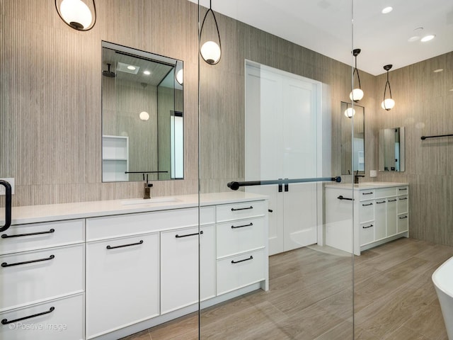 2118 N Clifton Ave, Chicago, IL 60614 - bathroom featuring vanity, wood finished floors, a shower, a freestanding bath, and backsplash