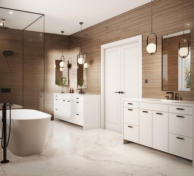 2118 N Clifton Ave, Chicago, IL 60614 - full bath with a sink, marble finish floor, two vanities, a soaking tub, and a stall shower
