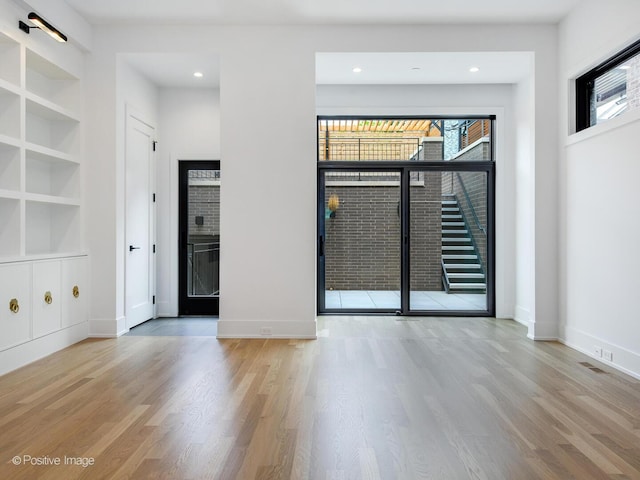 2118 N Clifton Ave, Chicago, IL 60614 - unfurnished room featuring built in shelves, baseboards, and wood finished floors