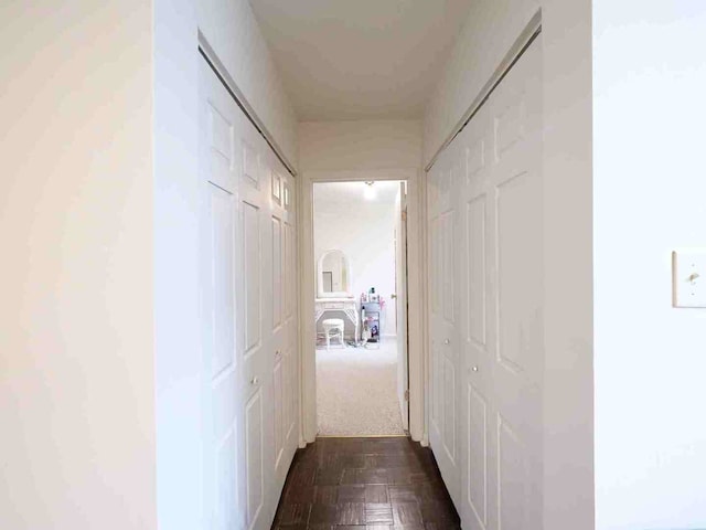 corridor with dark parquet floors