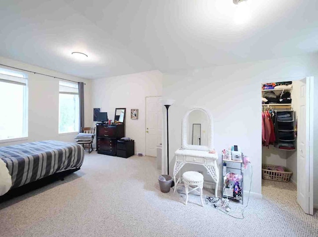 carpeted bedroom with a closet