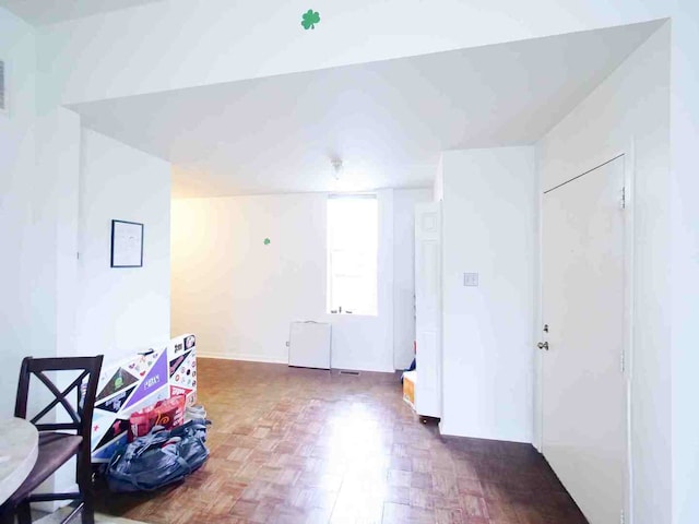 interior space featuring parquet flooring