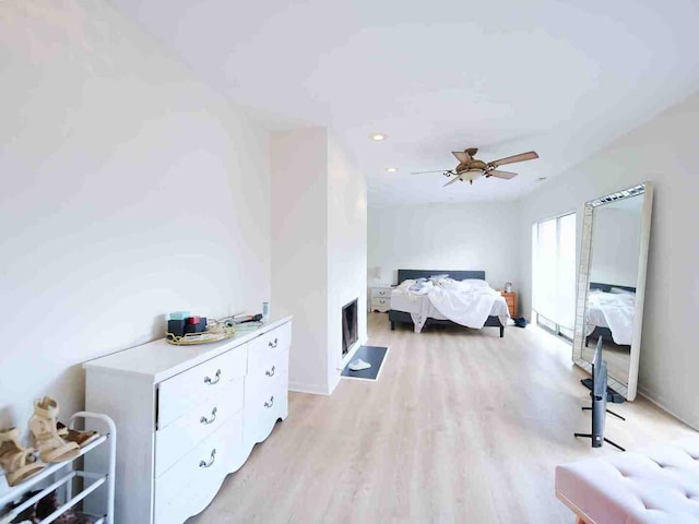 bedroom featuring ceiling fan and light wood-type flooring