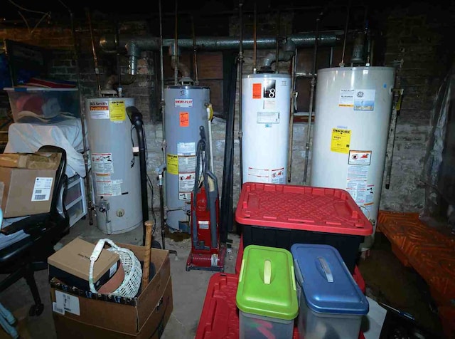 utility room featuring water heater