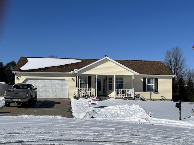 single story home featuring a garage and a porch