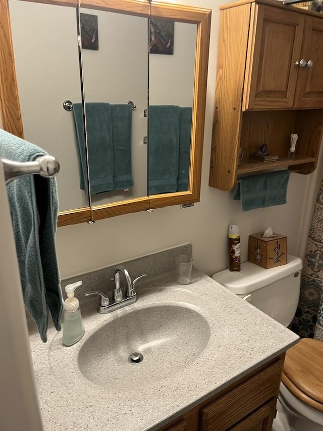 bathroom with vanity and toilet