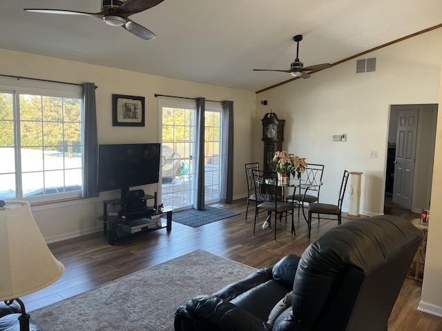 living room featuring ceiling fan, lofted ceiling, hardwood / wood-style floors, and plenty of natural light