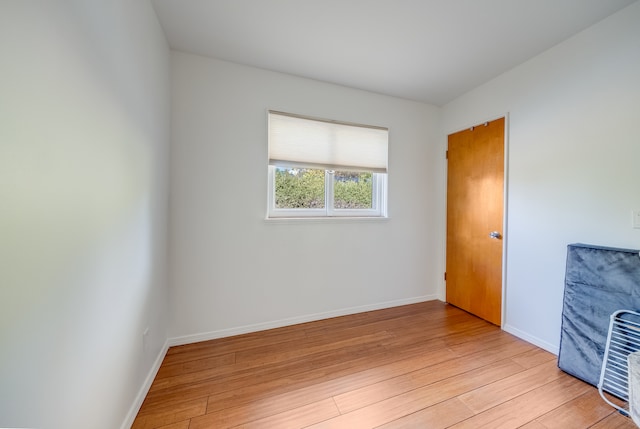 spare room featuring light hardwood / wood-style flooring