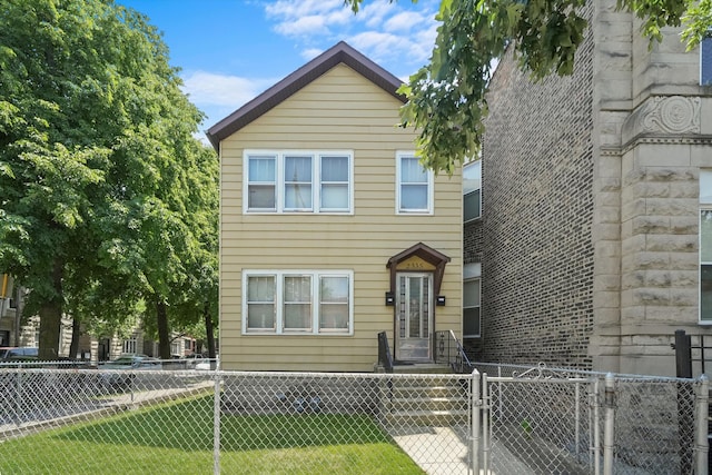 view of front of home featuring a front lawn