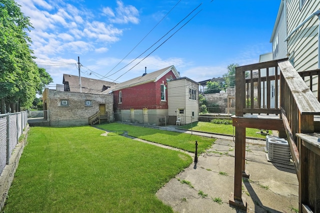 view of yard featuring central AC