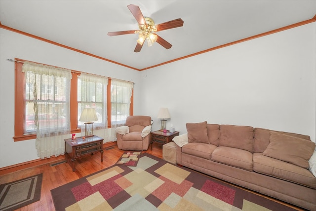 living room with ceiling fan, ornamental molding, and hardwood / wood-style floors