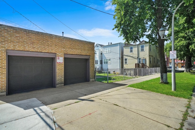 exterior space with a front lawn and a garage