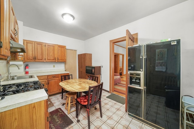 kitchen with sink and black appliances