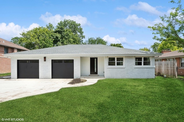 view of front facade featuring a garage and a front yard