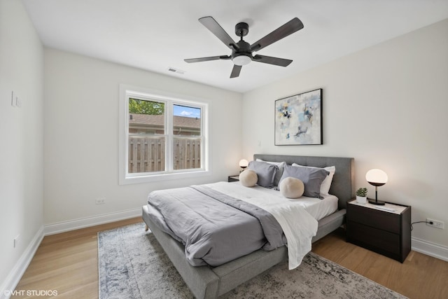 bedroom featuring light hardwood / wood-style floors and ceiling fan