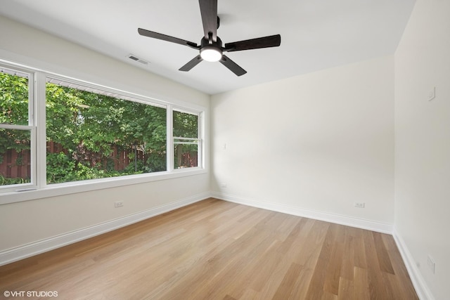 spare room featuring ceiling fan and light hardwood / wood-style floors