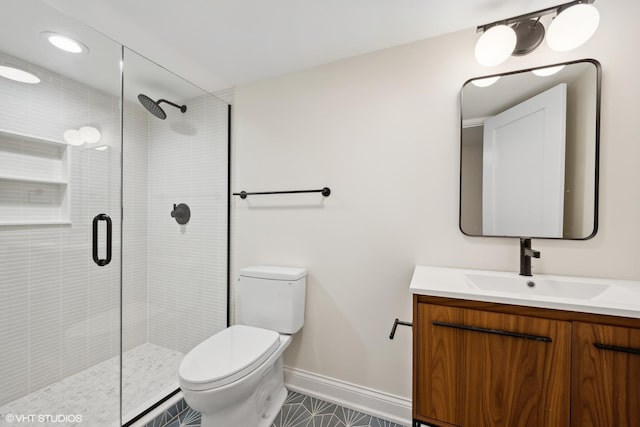 bathroom with an enclosed shower, vanity, toilet, and tile patterned flooring