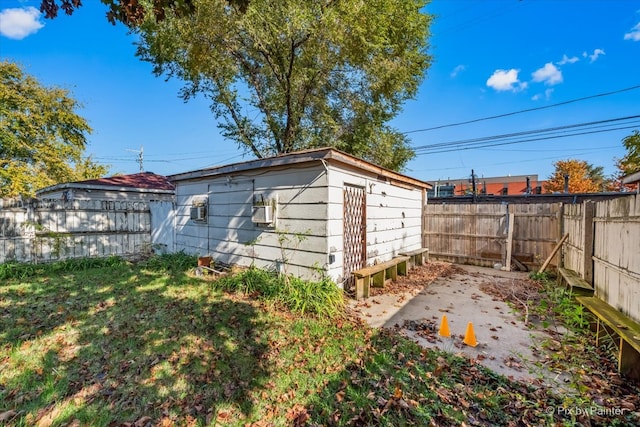 view of outbuilding with a yard