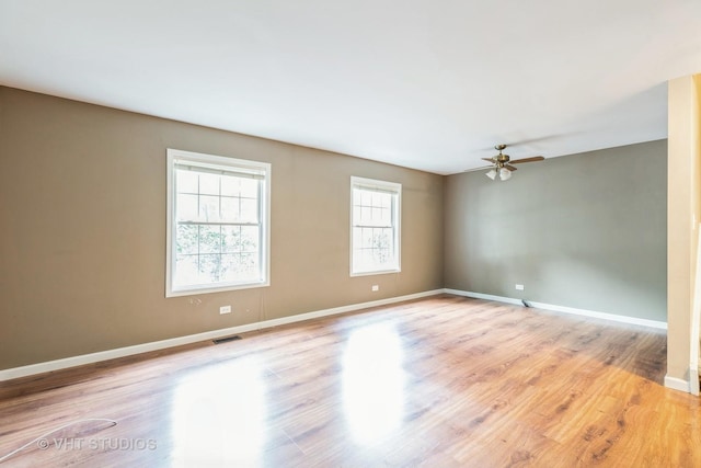 spare room featuring ceiling fan and light hardwood / wood-style floors