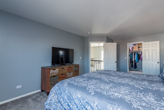 bedroom featuring a closet, carpet floors, and a spacious closet