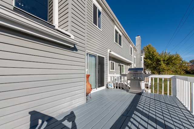 wooden terrace with grilling area