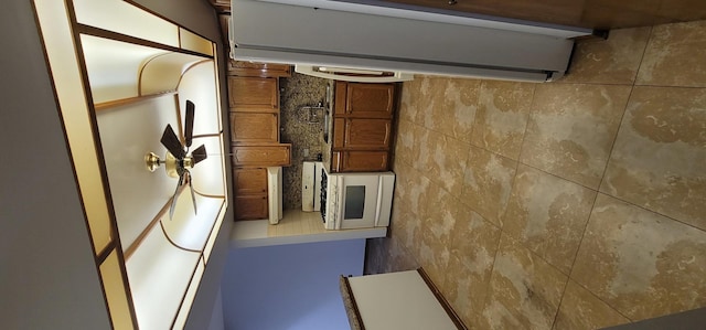 kitchen featuring tile walls