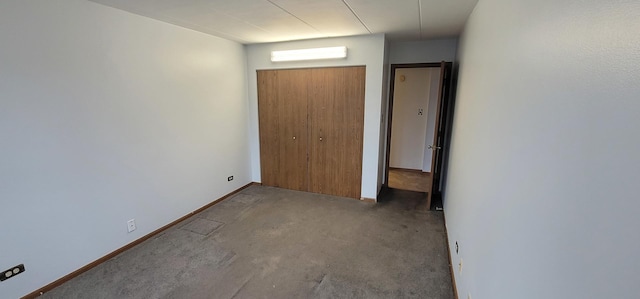 unfurnished bedroom with carpet and a closet