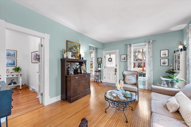 living room with light hardwood / wood-style flooring